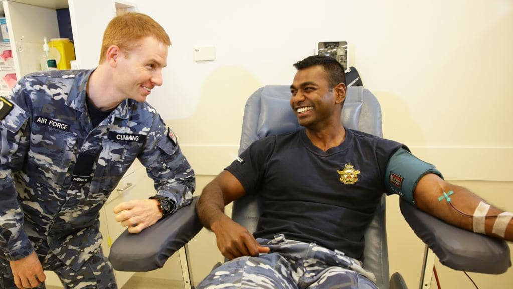 RAAF Glenbrook Commanding Officer Benjamin Wickham right and RAAF Glenbrook regular plasma donor Source Dept of Defence